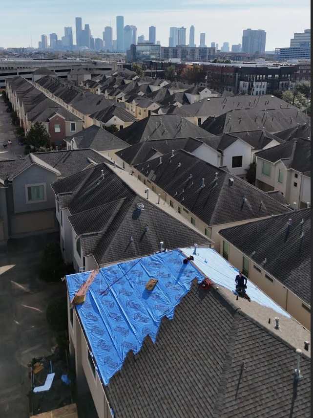 Synthetic roof underlayment storm repair Houston skyline