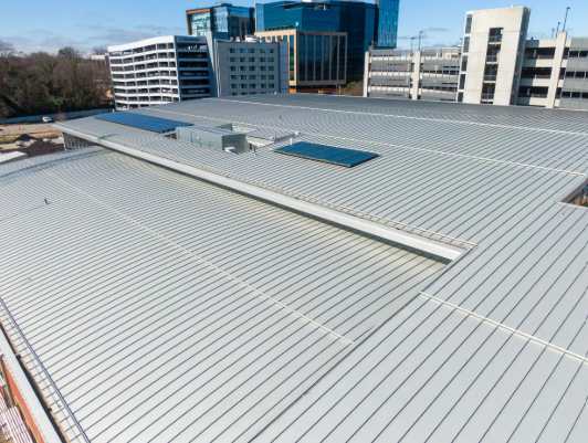 Aerial commercial metal roof city skyline