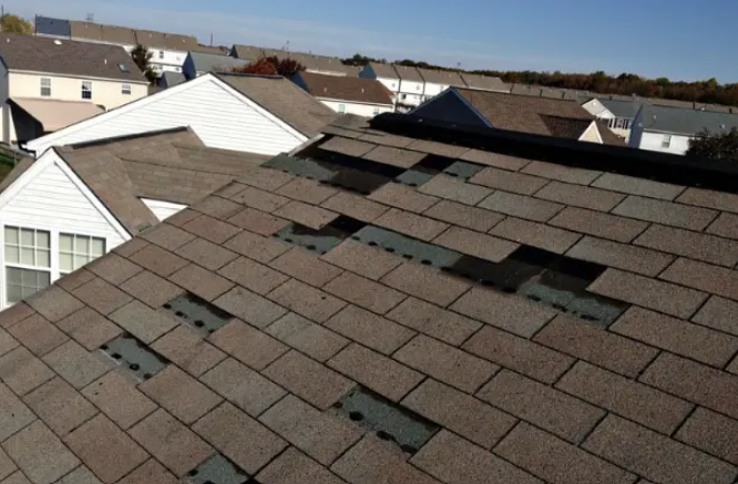 Missing shingles wind storm damage residential roof
