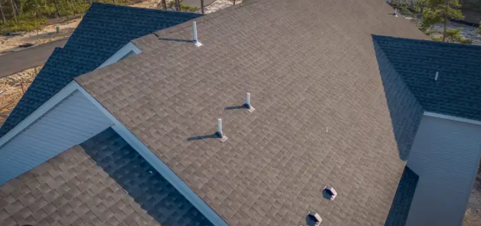 Drone view dark shingles new construction