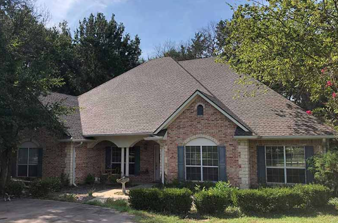Brick ranch house tan shingles